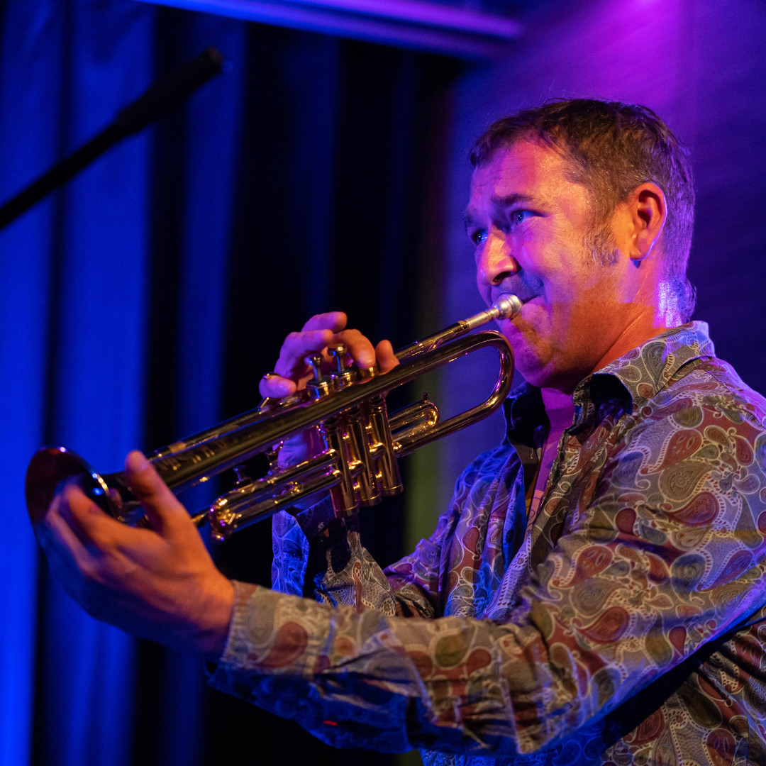 A photo of Fredi Lang playing the trumpet