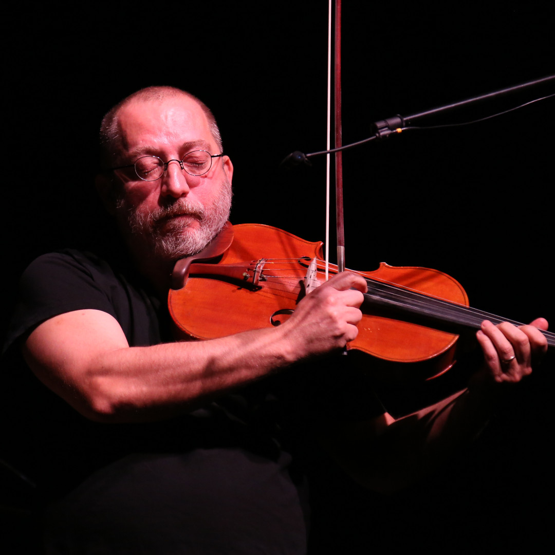 A photo of Szilard Mezei playing a viola