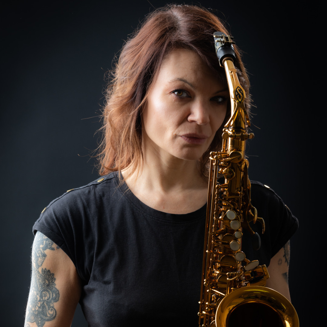 A photo of Jasna Jovićević holding a saxophone