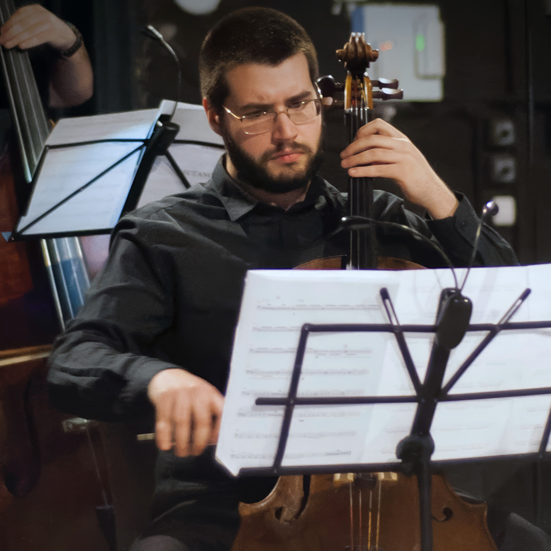 A photo of Pavle Popović playing a cello