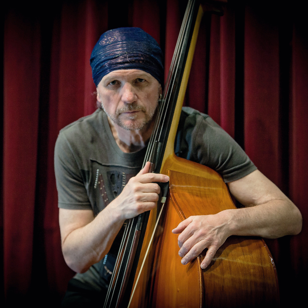 A photo of Reinhard Ziegerhofer holding an upright bass